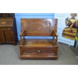 Late 19th century oak Gothic carved monks bench with flip top and storage base, 104cm wide