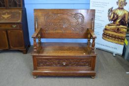 Late 19th century oak Gothic carved monks bench with flip top and storage base, 104cm wide