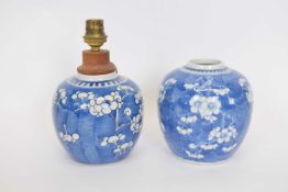 Two Chinese porcelain ginger jars, the blue ground with prunus decoration, one jar converted for