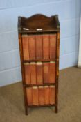 Small oak bookcase containing a set of Charles Dickens books