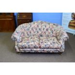 Lincoln House floral upholstered two-seater sofa with buttoned back and sides, 160cm wide