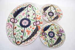 Large early 19th century English porcelain oval dish together with two plates, all with floral