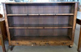 19th century rosewood veneered open bookcase with two adjustable shelves over two base drawers