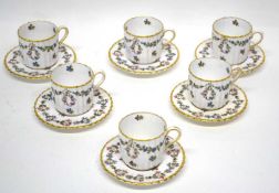 Late 19th century set of coffee cups and saucers of ribbed design, painted with flowers, by Copeland