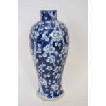 19th century Chinese porcelain vase, the blue ground with prunus and branch decoration, 24cm high