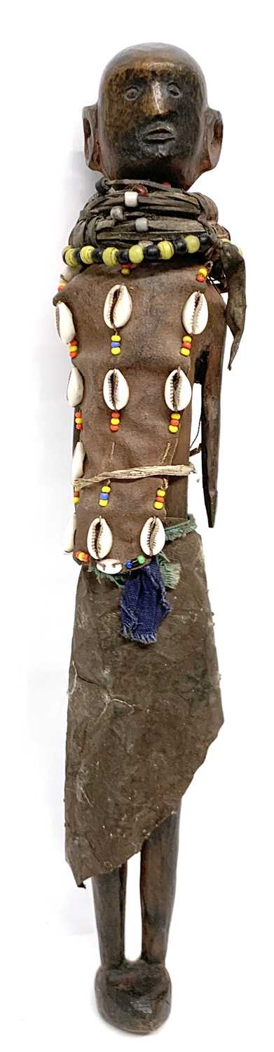 A kenyan decorated doll probably from the Samburu tribe