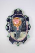 Majolica wall pocket modelled as an elephant's head on blue ground with majolica glazes