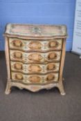 Continental small serpentine chest of drawers with four drawers raised on swept legs, decorated