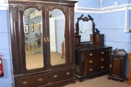 Late Victorian dark stained walnut bedroom suite comprising wardrobe with moulded cornice over two