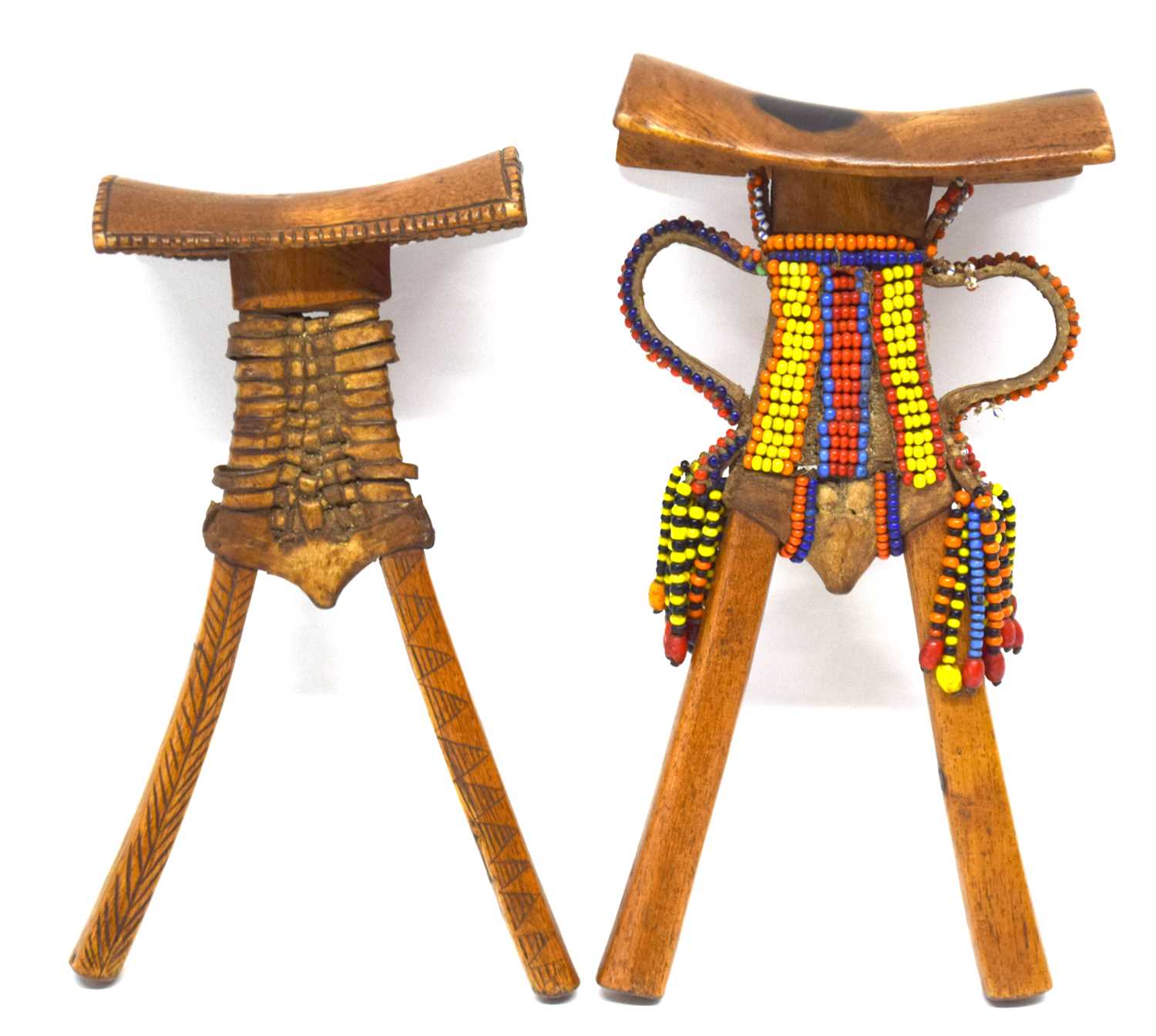 A Kenyan Pokot headrest with beaded decoration together with a similar plaited example (2)