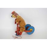 Model of a bear on a tricycle