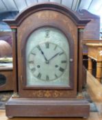 Edwardian mantel clock in arched mahogany and inlaid case, with brass movement striking on rods,