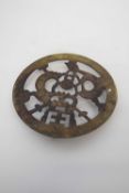 Brass trivet with a dragon design, probably Oriental, 15cm diam