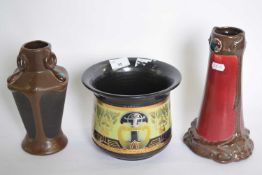 Three examples of Bretby pottery with Art Nouveau designs including two vases and small jardiniere