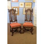 Pair of 19th century Carolean style cane backed chairs with elaborate carved frames and