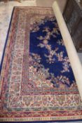 Large 20th century Grosvenor Kemnor Wilton floor rug, decorated with a floral and geometric design