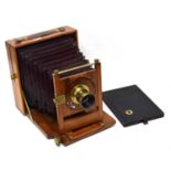 A VERY RARE WOODEN AND BRASS FIELD PLATE CAMERA WITH LENS WITH IDENTIFYING ENGRAVING WW