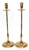Pair of brass candlesticks of slim baluster form with spreading circular feet, 40cm high