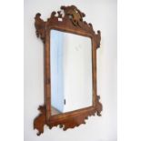 Small 19th century wall mirror in fretwork frame with ho-ho bird mount