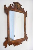 Small 19th century wall mirror in fretwork frame with ho-ho bird mount