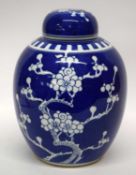 Large Chinese porcelain ginger jar and cover, the blue ground with prunus decoration