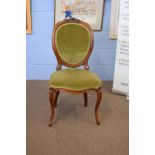 Single Victorian mahogany framed side chair with upholstered back and seat, raised on short cabriole