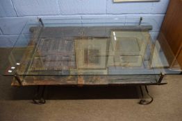 Unusual contemporary coffee table of rectangular form with glass top over a base formed from an