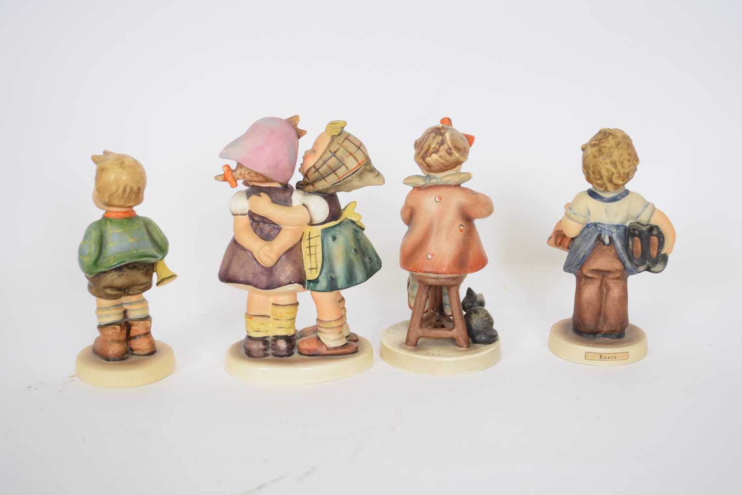Group of four Goebel figures of children, designed by Hummel, including Boots and others (4) - Image 2 of 2