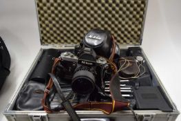 NIKON SLR CAMERA TOGETHER WITH A CASE OF TELEPHOTO LENSES, FILTERS, ADAPTERS ETC