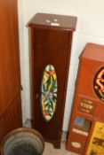 NARROW DARK WOOD FINISH CABINET WITH COLOURED GLASS DECORATION TO THE DOOR