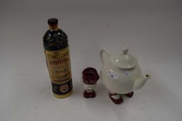 MIXED LOT COMPRISING A GERMAN POTTERY SCHLICHTE BOTTLE, TOGETHER WITH A NOVELTY WALKING TEA POT