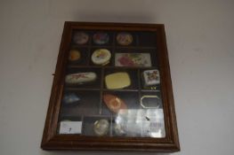 SMALL DISPLAY CABINET CONTAINING VARIOUS ENAMEL AND OTHER DECORATED PILL BOXES