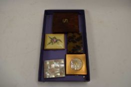 BOX OF POWDER COMPACTS
