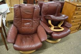 TWO BROWN LEATHER STRESSLESS RECLINER ARMCHAIRS AND ACCOMPANYING FOOTSTOOL (3)