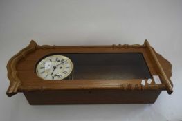 MODERN OAK CASED WALL CLOCK