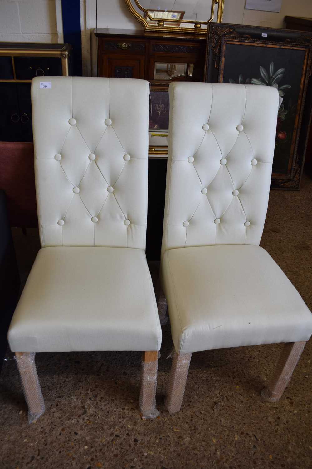 PAIR OF CREAM BUTTON UPHOLSTERED DINING CHAIRS