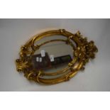 MODERN OVAL WALL MIRROR SET IN GILT FRAME