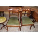 PAIR OF 19TH CENTURY MAHOGANY SABRE LEG DINING CHAIRS WITH GREEN SEATS