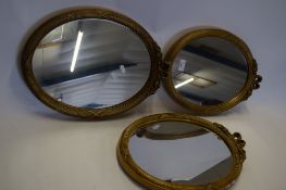 THREE 20TH CENTURY OVAL WALL MIRRORS IN GILT FINISH FRAMES WITH RIBBON DECORATION