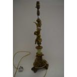 LARGE BRASS MOUNTED TABLE LAMP WITH CHERUB DECORATION AND THREE FOOTED BASE