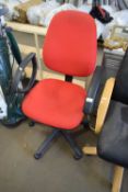 RED UPHOLSTERED OFFICE CHAIR