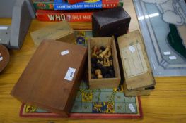 THREE BOXES CONTAINING CHESS PIECES, A BOX CONTAINING DOMINOES AND SNAKES AND LADDERS BOARD