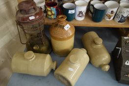THREE STONEWARE HOT WATER BOTTLES, A STONEWARE BREWERY FLAGON FOR MORGANS BREWERY, NORWICH AND A