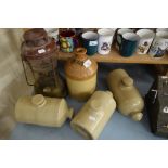 THREE STONEWARE HOT WATER BOTTLES, A STONEWARE BREWERY FLAGON FOR MORGANS BREWERY, NORWICH AND A