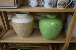 LARGE CERAMIC VASE WITH WICKER SURROUND TOGETHER WITH A FURTHER GREEN GLAZED JAR AND COVER