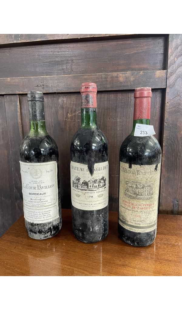 Three bottles: Chateau Tour Deyot 1976, Lacour Pavillion Bordeaux 1978 and Chateau D'Angludet,