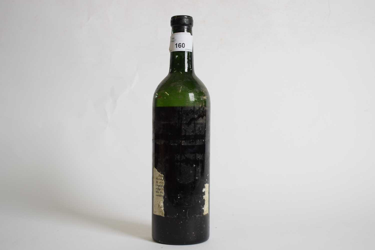 One unlabelled bottle, (level depleted)