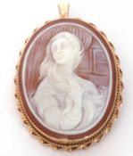 Cameo brooch/pendant, the carved oval shell cameo depicting a classical lady beside a window, framed