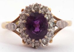 Amethyst and diamond cluster ring, the oval faceted amethyst raised within a small single cut