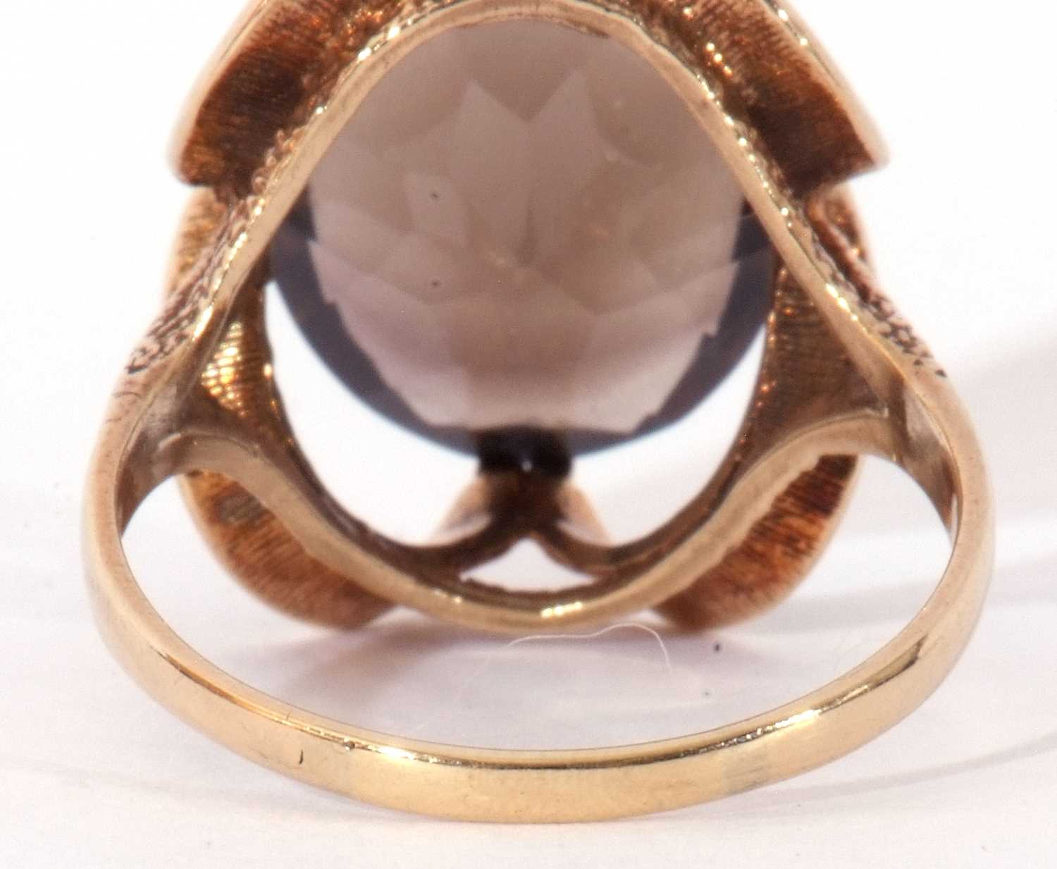 9ct gold smoky quartz dress ring, the large oval faceted quartz cardinal set in a stylised mount, - Image 5 of 9